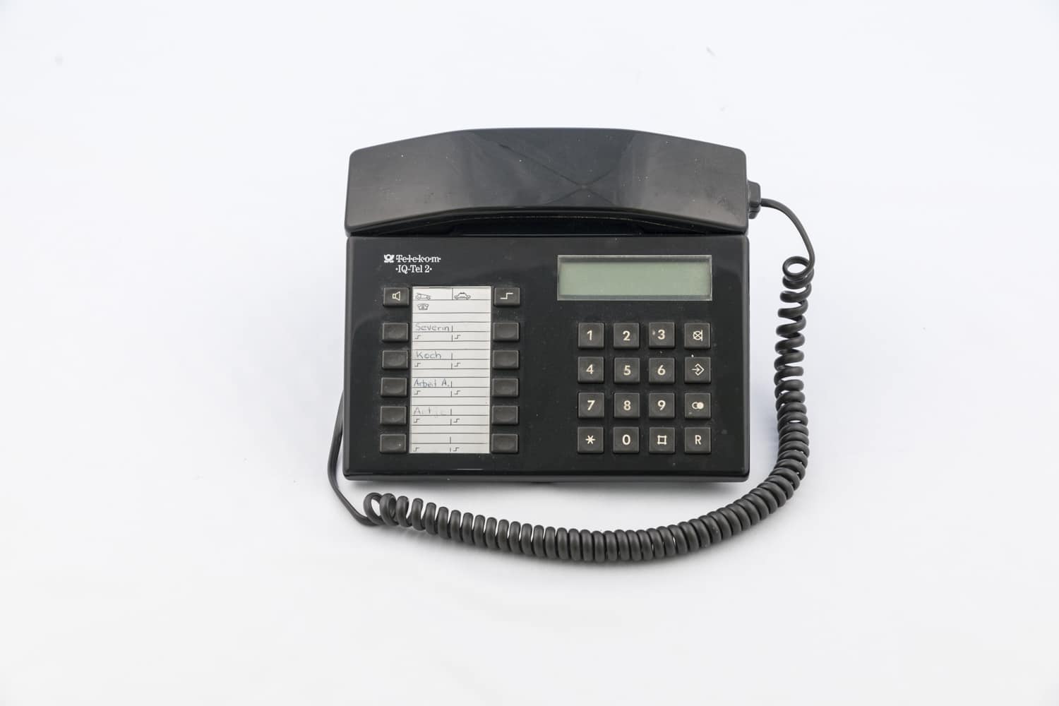 Black plastic push-button telephone